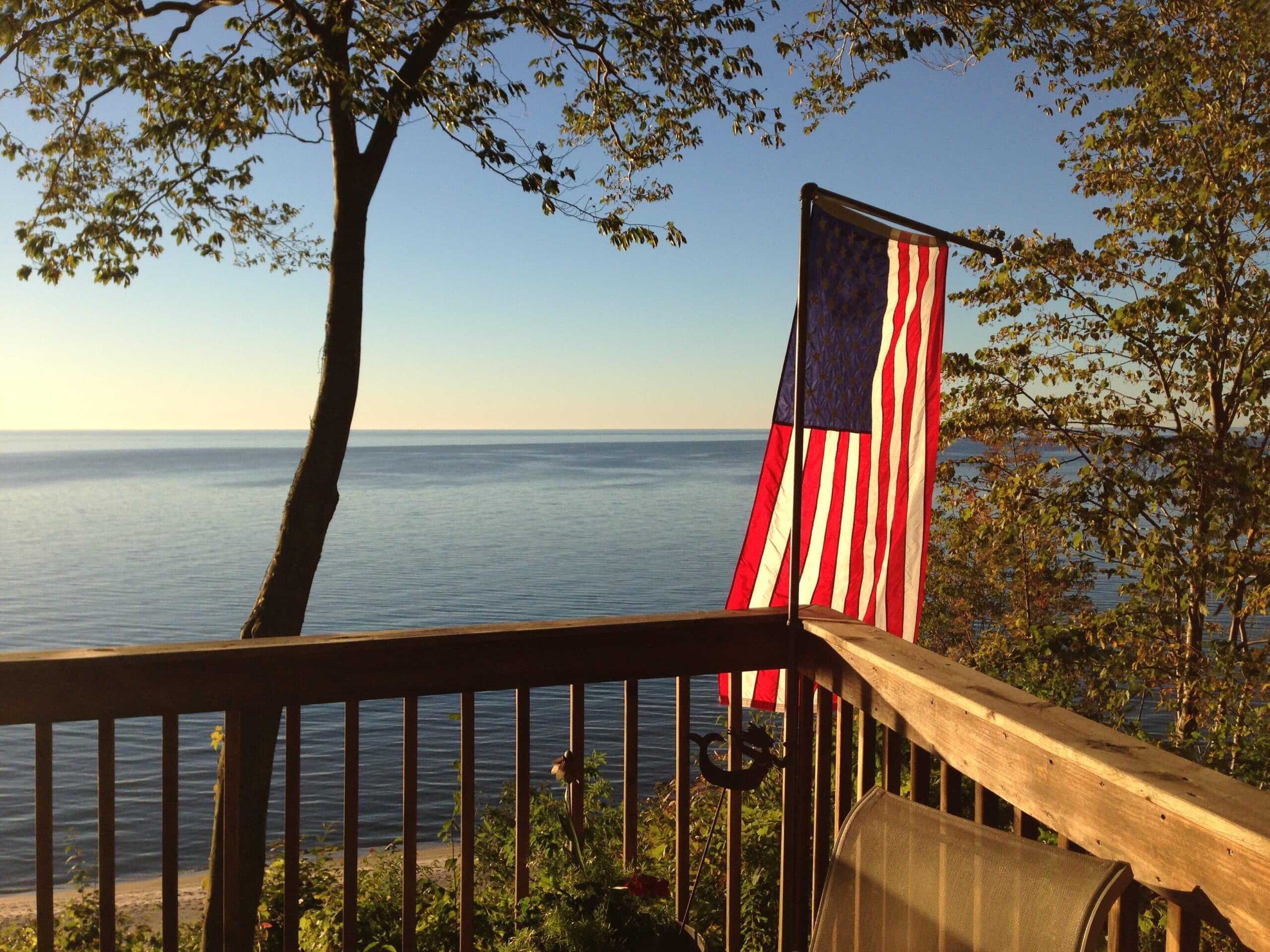 American flag over a Lake Michigan sunset